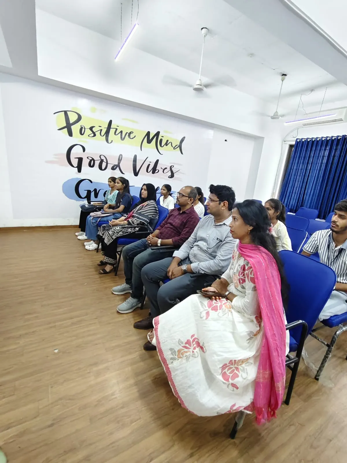 Faculty and students seated in a classroom session