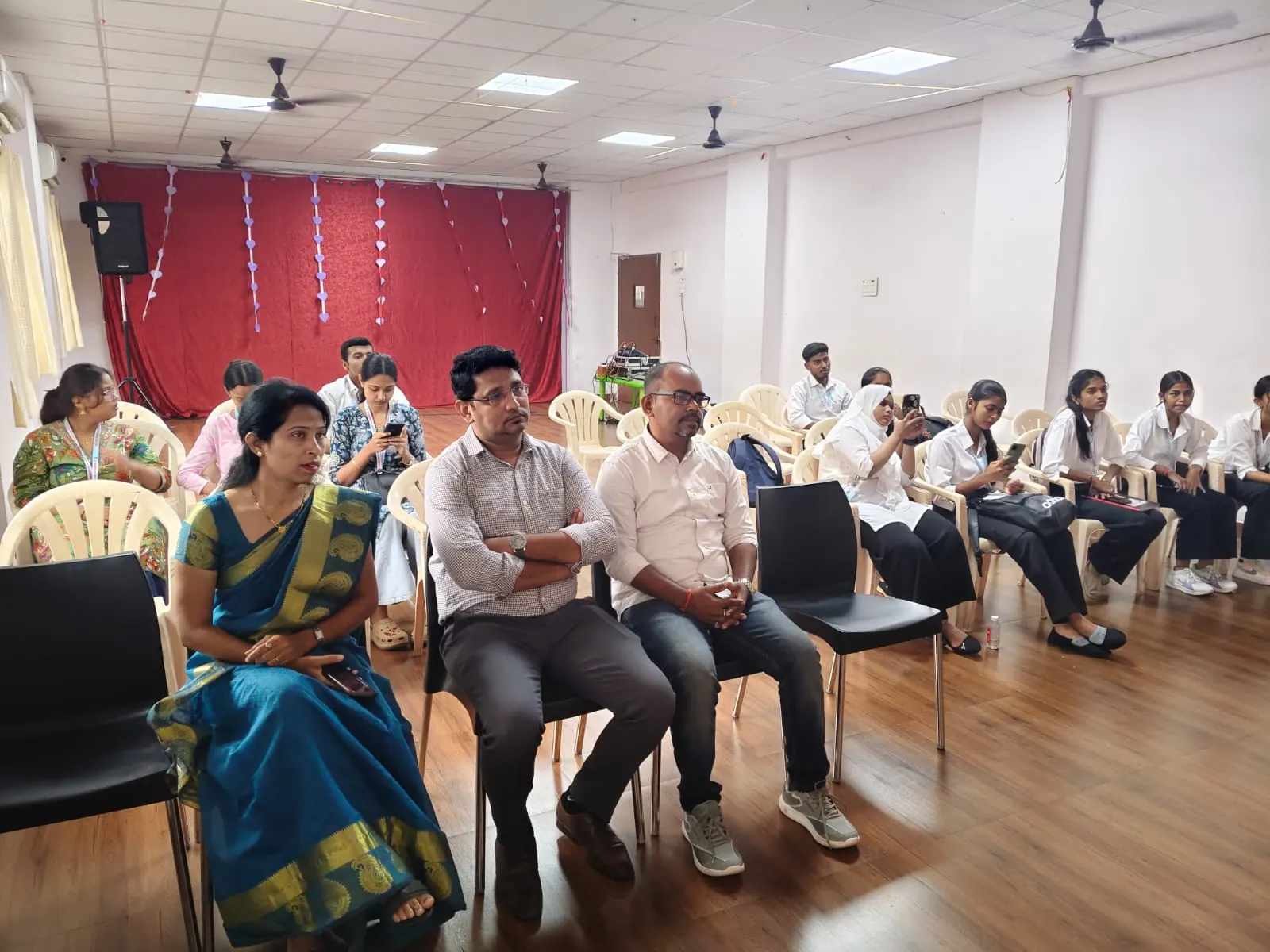 Guests seated in the front row at an institute function